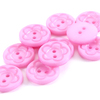 Пуговица детская на два прокола кругл Цветок 18 мм цвет св-розовый упаковка 28 шт фото