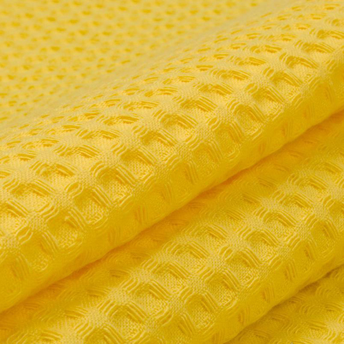 Ткань на отрез вафельное полотно гладкокрашенное 150 см 240 гр/м2 7х7 мм цвет 257 желтый фото 1